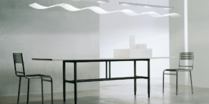 a table with two chairs apart in a minimalist environment, in minimalism and white supremacy