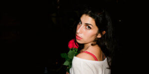 amy winehouse holding a rose by charles moriarty_New Amy Winehouse Biopic “Back to Black” fails to live up to the artist