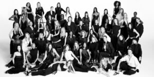 Black-and-white group portrait of models in Zara’s 50th Anniversary Campaign, showcasing glamour amid fast fashion controversy.