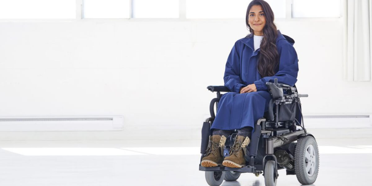Model Aariana Philip Taylor confidently walks the runway in an inclusive fashion show during New York Fashion Week, representing disabled, Black, and trans communities.