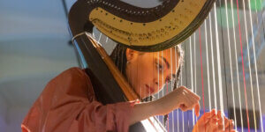 Jazz harpist Miriam Adefris in a spiritual jazz-inspired header image, symbolizing the revival from Alice Coltrane to André 3000.