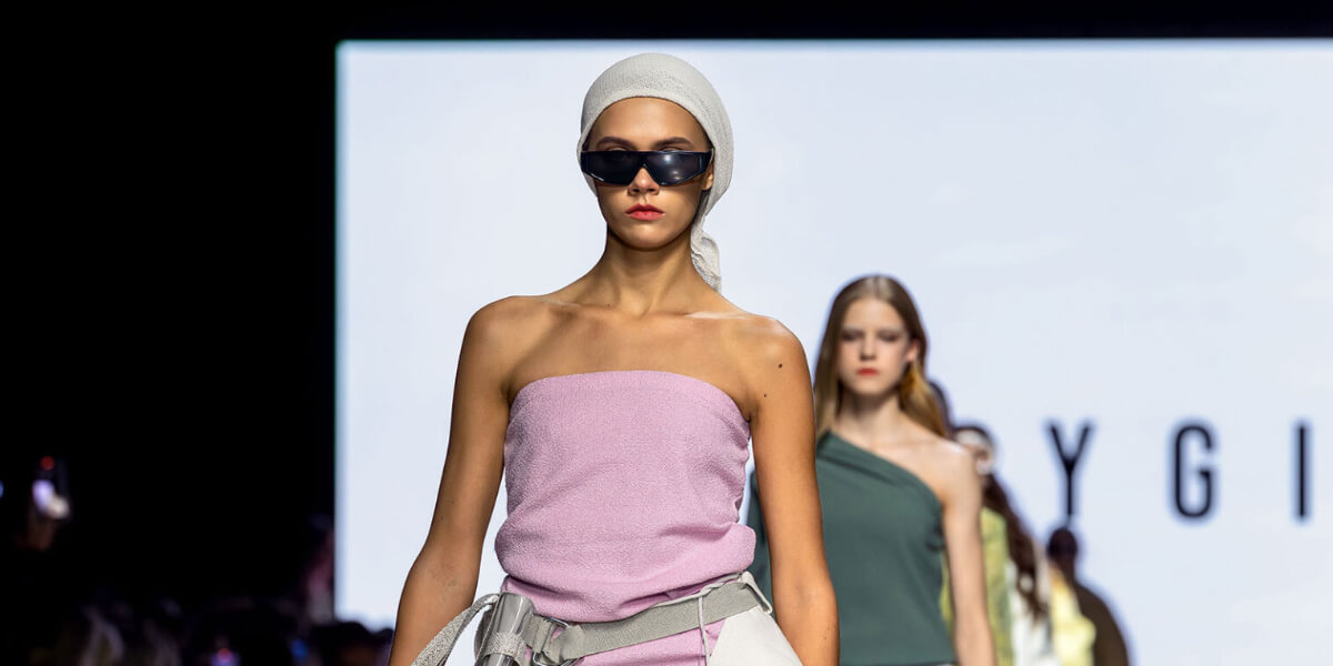 Szczygiel runway look at Riga Fashion Week merging Baltic minimalism with avant-garde sustainability.