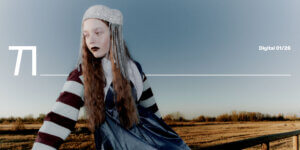 Fashion editorial set in the Italian countryside featuring a model in a soft knit look and statement accessories, styled against winter fields with a floral headpiece, photographed by Pietro Groff.