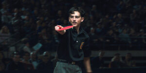 Marty Mauser, the ambitious table tennis prodigy from Josh Safdie’s film Marty Supreme, competing intensely during a match set in 1950s New York