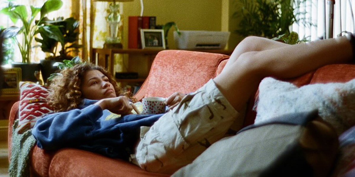 Rue Bennett, played by Zendaya, sits across from Ali, portrayed by Colman Domingo, during an intense diner conversation in Euphoria highlighting the show’s themes of addiction and recovery.