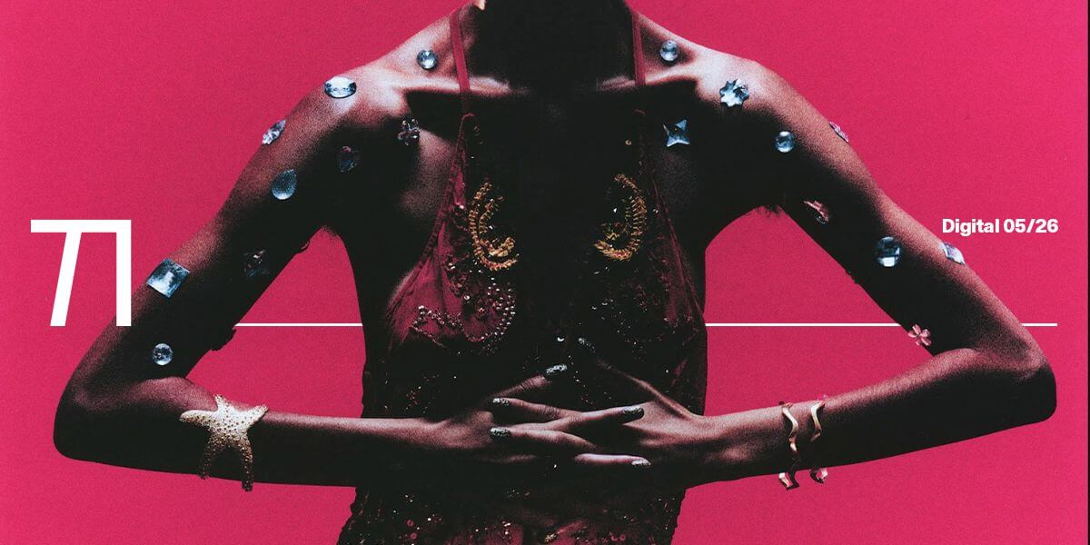 Model in sculptural jewelry and dramatic noir-inspired lighting for TITLE May Digital Cover photographed by Holly McCandless-Desmond and styled by Pav Nagra