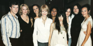 Cast of The L Word posing together, representing queer romance, lesbian relationships, female friendship, and the female gaze in television.