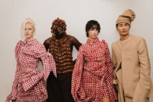 Frank Aghuno presents Fruché SS27 "KLEG" at Berlin Fashion Week, showcasing Nigerian craftsmanship, Adire textiles, Gingham fabrics, and contemporary African fashion.