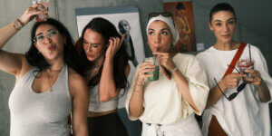 Guests enjoy healthy smoothies and community during the TITLE Magazine RESET print launch event at ANTIclub in Berlin, celebrating wellness and connection.