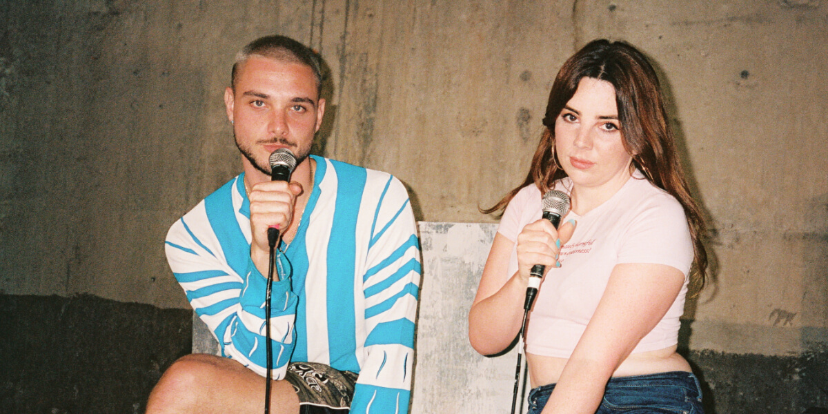 Zooey Gleaves speaking into a microphone during a cultural conversation