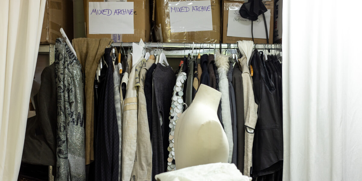 SF1OG Berlin studio with clothing rack, archival garments and mannequin