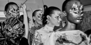 Models with abstract face paint backstage at London Fashion Week SS27